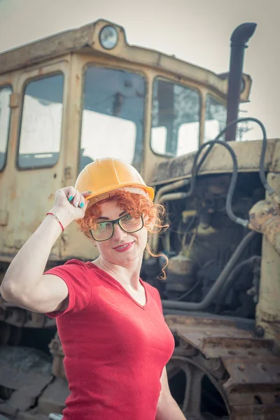 Woman is an engineer. Woman in a construction helmet