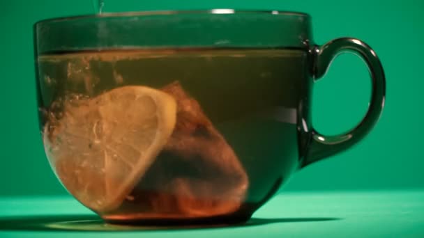 Tea Cup Filled Boiling Water Lemon Tea Leaves — Stock Video