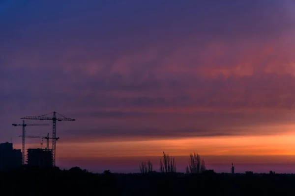 New building. Construction crane at dawn — Stock Photo, Image