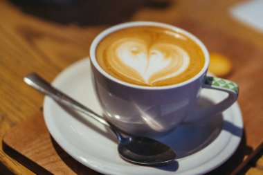 Cappuccino. A cup of cappuccino with foam in the form of a heart