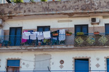 Residential buildings in Italy. On the balconies to dry things.