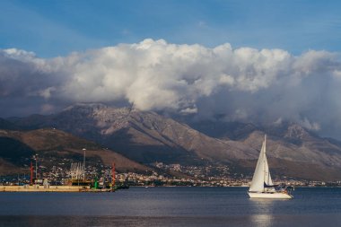 Yacht. The yacht floats on the sea against the backdrop of the m