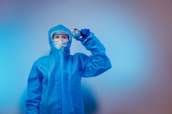 Virus Paramedic Protective Suit Virus Holds Small Globe His Hand — Stock Photo, Image