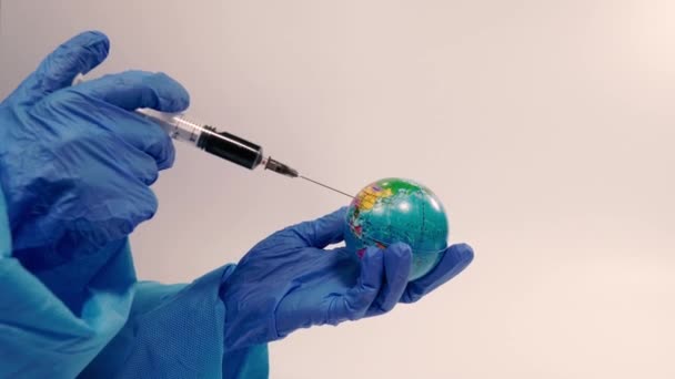 Virus Doctor Makes Injection Planet Earth — Stock Video