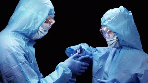 Virus Two Doctors Protective Antiviral Suit Disinfect Each Other Hands — Stock Video