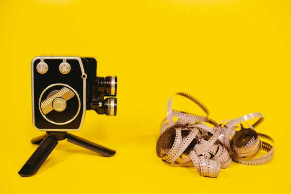 Retro camera. Retro camera and movie film on which the camera shoots.