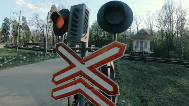Road sign. Iron level crossing without a barrier.