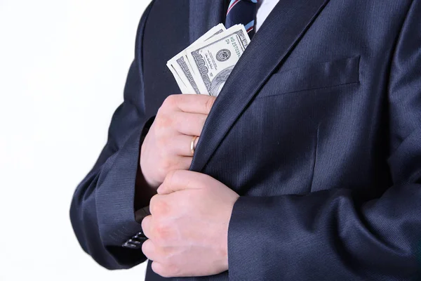 Businessman putting money in suit jacket pocket — Stock Photo, Image
