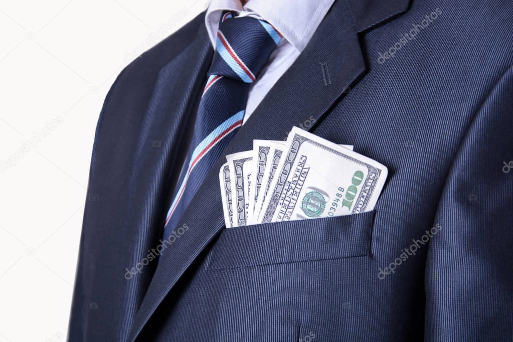 Money in the pocket of business suit