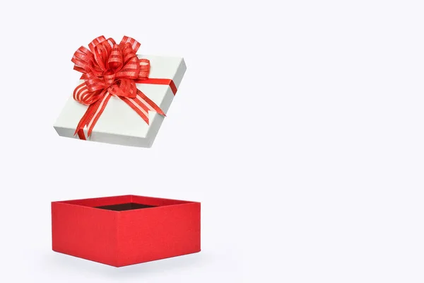 Festive empty gift box isolated on a white background. Empty red box with a lid flying in the air. Surprise — Stock Photo, Image