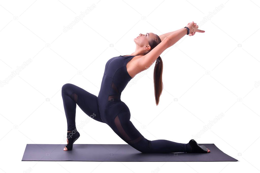 Athletic beautiful girl doing yoga exercise on a white background. Healthy lifestyle concept.