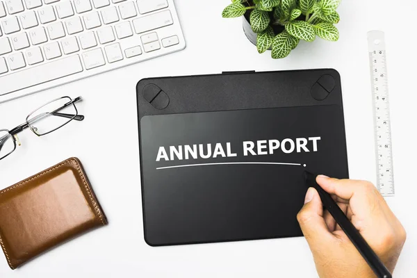 Hand writing on book message Annual Report. — Stock Photo, Image