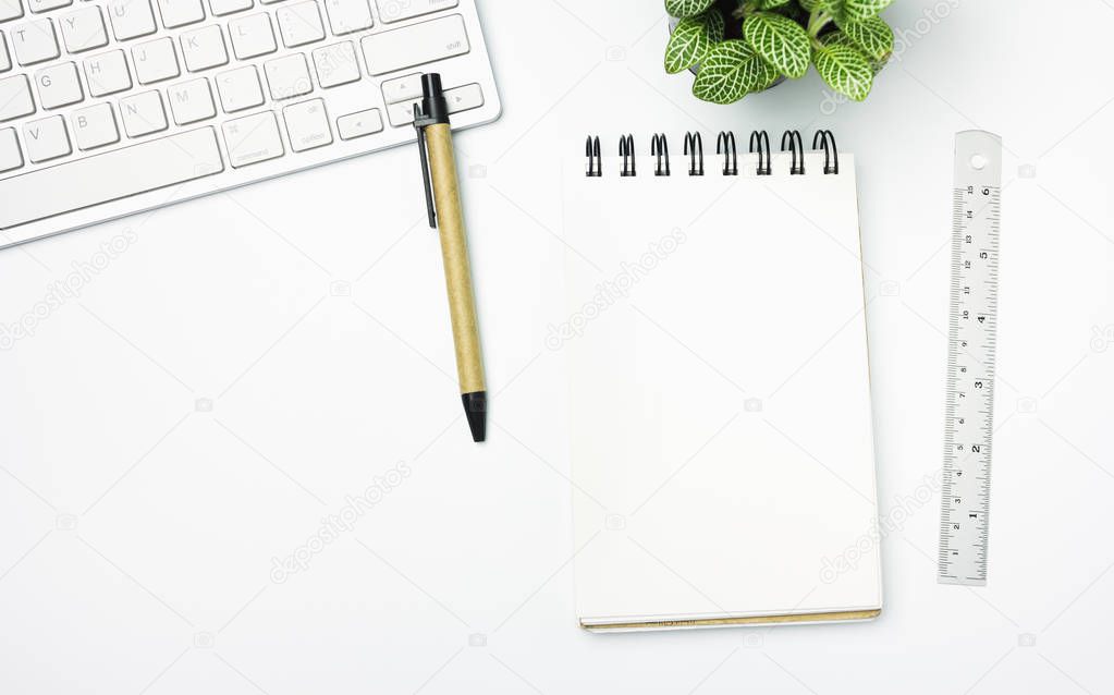 White designer office desk table with blank paper with pen, ruler. Top view, flat lay.