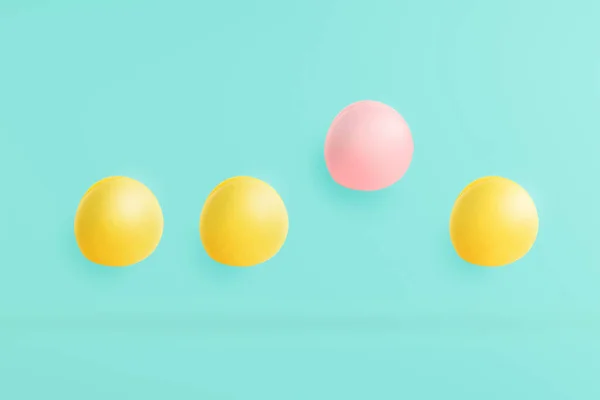 Macarons on a blue background with pastels and pink highlights. The concept is differently harmonized in the object and used as a background on the web site. — Stock Photo, Image