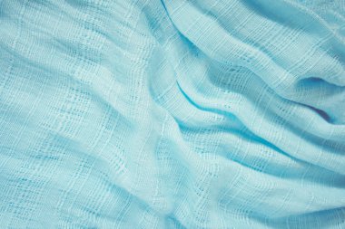 Eşarp mavi kumaş. Işık ve gölge bir dalga göstermeleridir. İçin arka planda olmak.