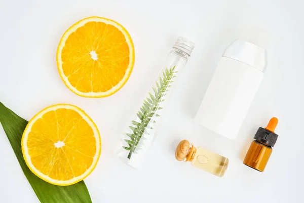 Ingredients of skin care products. And honey in the glass, Blank label package for mockup on white background and flowers. The concept of natural beauty products. — Stock Photo, Image