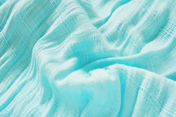 Eşarp mavi kumaş. Işık ve gölge bir dalga göstermeleridir. İçin arka planda olmak.