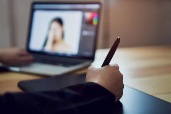 Businessman is working with a computer graphic designer. and color chart.