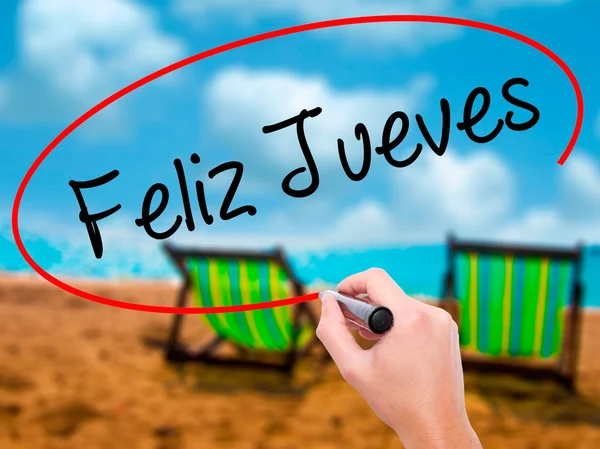 Člověk ruku psaní Feliz Jueves (Happy čtvrtek ve španělštině) s b — Stock fotografie