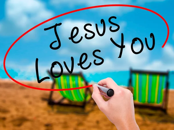 Man Hand writing Jesus Loves You with black marker on visual scr