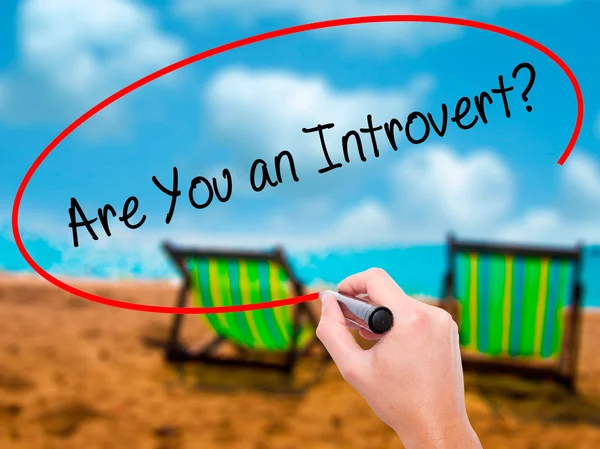 Man Hand writing Are You an Introvert? with black marker on visu — Stock Photo, Image