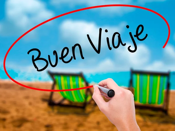 Человек, пишущий Buen Viaje ("Хорошее путешествие по-испански") с черным цветом — стоковое фото