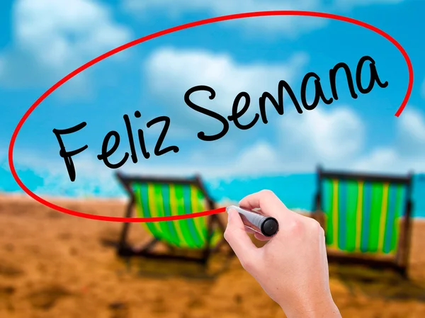 Man Hand writing Feliz Semana (Happy Week in Spanish / Portuguese — стоковое фото