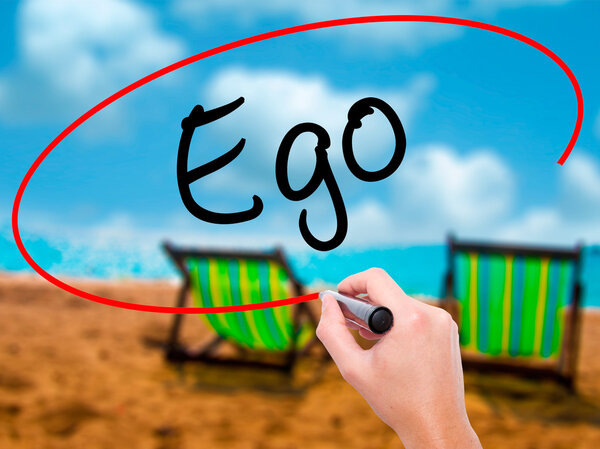 Man Hand writing Ego with black marker on visual screen