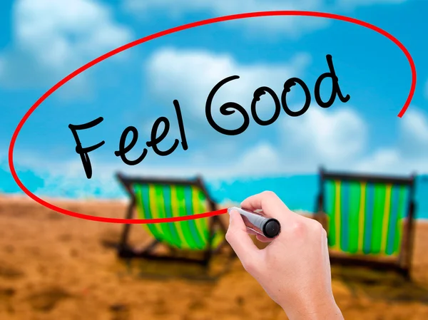 Adam el Feel Good siyah kalemi ile görsel ekranda yazma — Stok fotoğraf