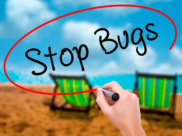 Man Hand writing Stop Bugs with black marker on visual screen — Stock Photo, Image