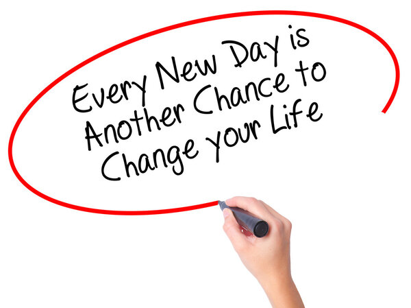 Women Hand writing Every New Day is Another Chance to Change you