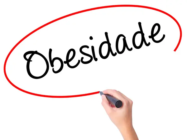 Women Hand writing Obesidade (Obesity in Portuguese)  with black