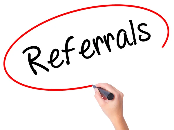 Women Hand writing Referrals with black marker on visual screen. — Stock Photo, Image