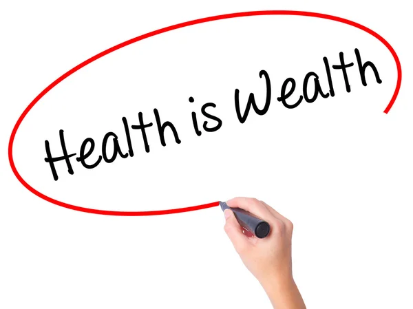 Women Hand writing Health is Wealth with black marker on visual — Stock Photo, Image