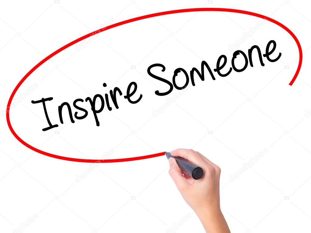 Women Hand writing Inspire Someone  with black marker on visual 