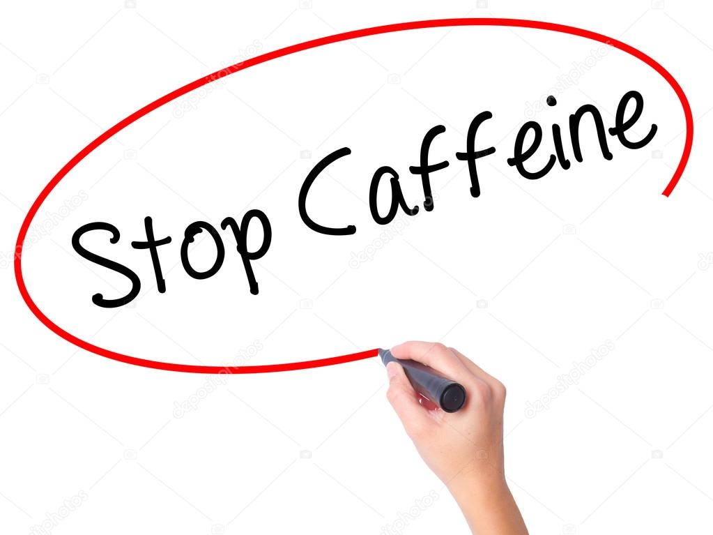 Women Hand writing Stop Caffeine with black marker on visual scr
