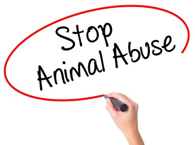 Women Hand writing Stop Animal Abuse with black marker on visual clipart