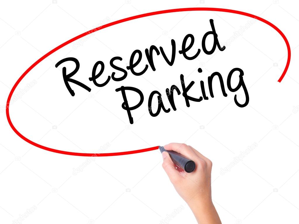 Women Hand writing Reserved Parking with black marker on visual 