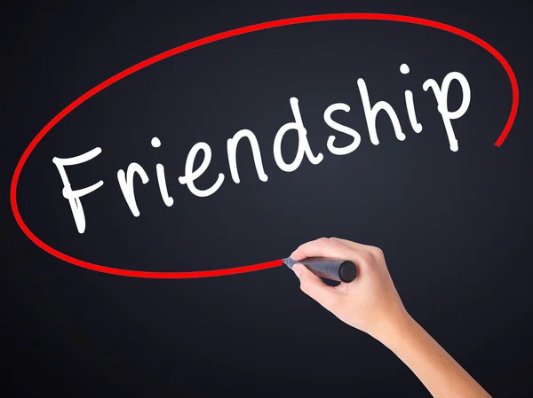 Woman Hand Writing Friendship with a marker over transparent boa — Stock Photo, Image