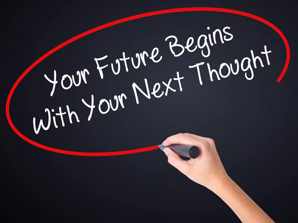 Woman Hand Writing Your Future Begins With Your Next Thought wit