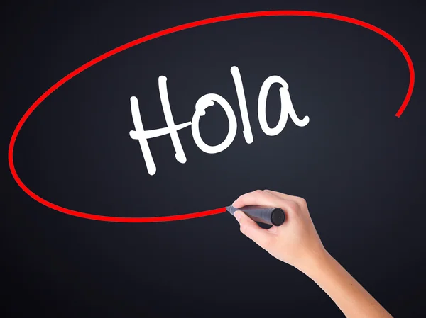 T üzerinden bir marker ile kadın el yazma Hola (İspanyolca Merhaba) — Stok fotoğraf