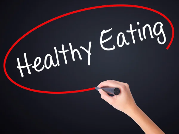 Woman Hand Writing Healthy Eating with a marker over transparent — Stock Photo, Image