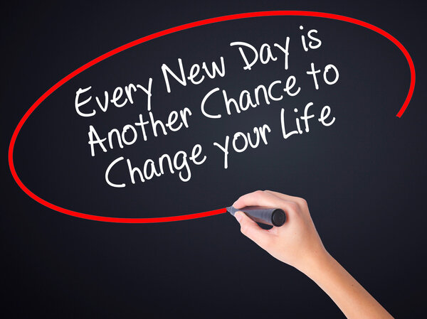 Woman Hand Writing Every New Day is Another Chance to Change you