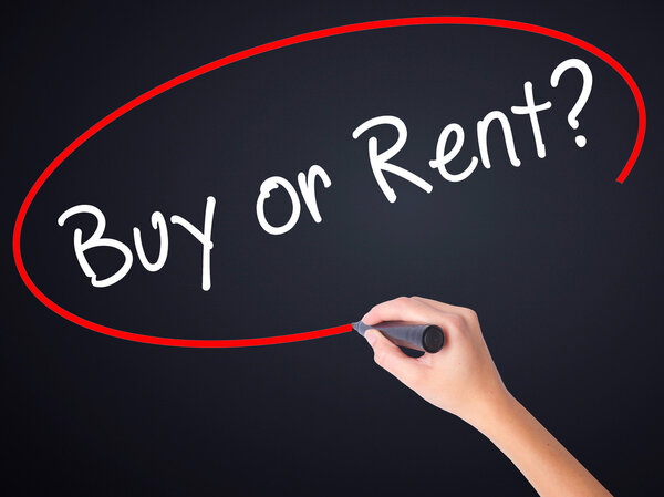 Woman Hand Writing Buy or Rent? with a marker over transparent b