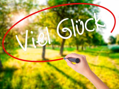 Bir marke ile kadın el yazma Viel Gluck (iyi şans Almanca)