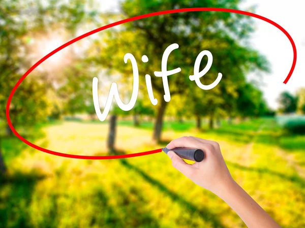 Woman Hand Writing Wife with a marker over transparent board — Stock Photo, Image