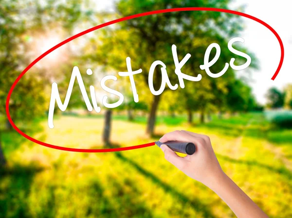 Woman Hand Writing  Mistakes with a marker over transparent boar — Stock Photo, Image