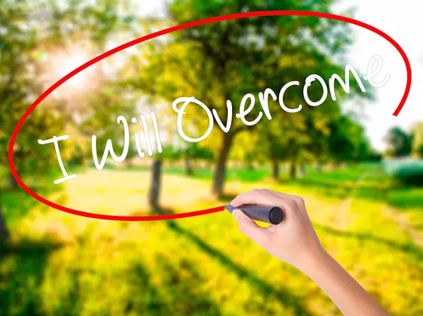 Woman Hand Writing I Will Overcome con un marcador sobre transparen — Foto de Stock