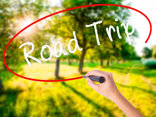 Woman Hand Writing Road Trip with a marker over transparent boar — Stock Photo, Image