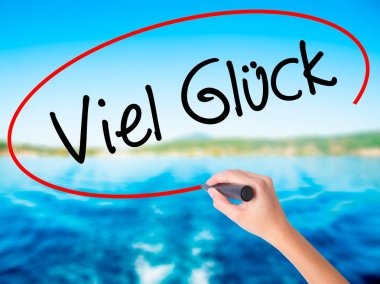 Bir marke ile kadın el yazma Viel Gluck (iyi şans Almanca)